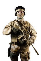 Isolated desert soldier with rifle.