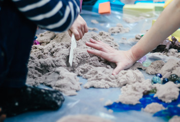 Obraz na płótnie Canvas Sand therapy. Photo of hands with sand