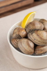 Portion of vongole with a slice of lemon in seafood restaurant
