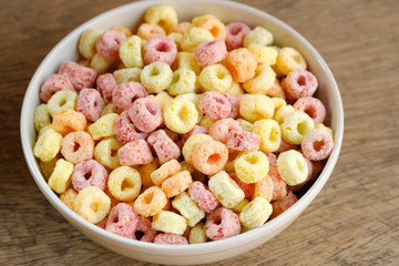 Cereal flakes in bowl with copy space,Breakfast concept.Food with delicious fruity taste and fruity colours.It's made with maize,wheat,and barley