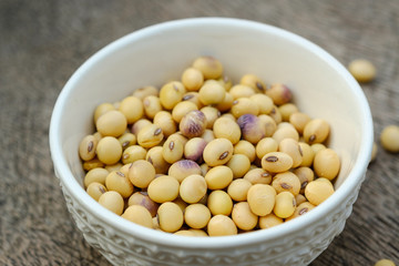 Soy bean in bowl on  wooden floor
