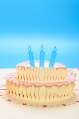 a card with birthday cake as a gift on blue background