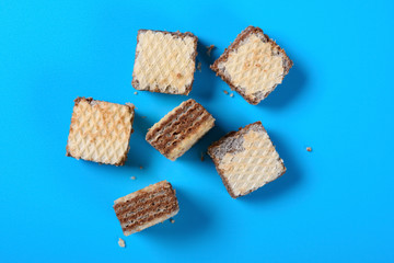 top view chocolate wafer blocks on a blue background