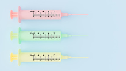 Syringes pink,with green and yellow arranged on a blue pastel background. Clipping path and copy space for your text, 3D Render.