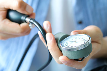 Man check blood pressure monitor and heart rate monitor with digital pressure gauge. Health care...