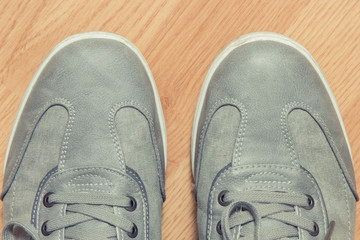 Casual gray leather shoes on board, male footwear concept