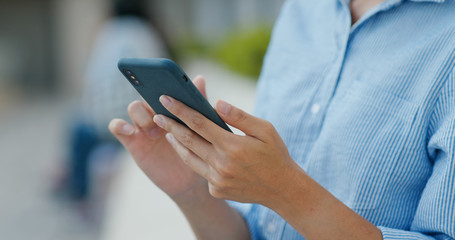 Woman use of mobile phone at outdoor
