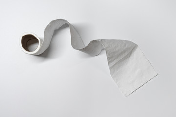 Toilet Paper Running Low with white background as panic buying triggers a supply shortage during the Coronavirus COVID-19 shelter in place quarantine lockdown