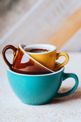 Fresh coffee in a colorfull cups on texture background