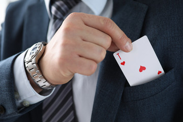Man suit takes an ace card from his jacket pocket. One-sided advantage and benefit. Technique or...