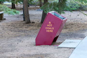 Hot coal disposal bin in a shaded day use area at lake tahoe