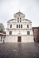 Fototapeta na wymiar Facade of the Church San Zaccaria in Venice. Italy. Cloudy Sky. Rainy Weather.