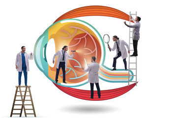 Doctor examining giant eye in medical concept