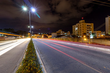 Fototapeta na wymiar long exposure in night city traffic XIII