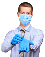 Businessman in medical mask, glasses, dresses rubber gloves