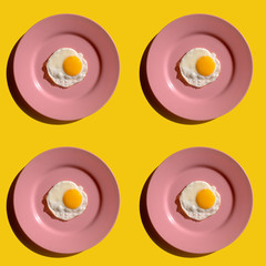 Fried eggs on pink plate, seamless pattern
