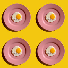 Fried eggs on pink plate, seamless pattern