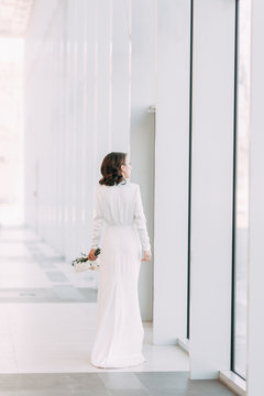  Stylish European wedding. Modern trends in the image of the bride. Bright portrait of the bride in the Museum.