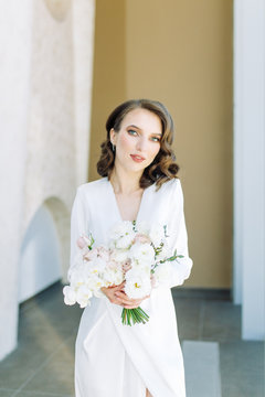  Stylish European wedding. Modern trends in the image of the bride. Bright portrait of the bride in the Museum.