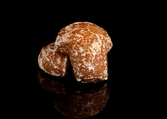 gingerbread with cream filling in a section on a black background