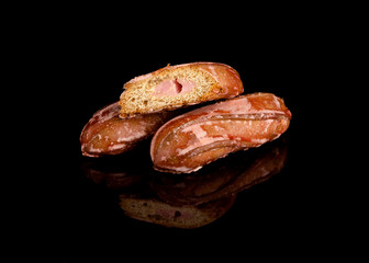 gingerbread with peach filling in the section on black background