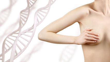 Young woman checks breasts for neoplasms among DNA chains.