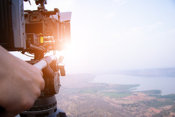 people travel in the nature and using drone take photo with happy.
