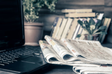 Media concept. Newspapers on the coffee table.