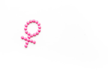 Gender Venus symbol made of contraceptive pills - woman health concept - on white background top-down copy space