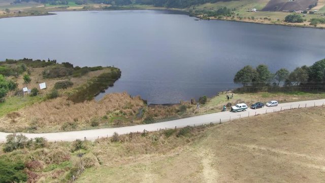 Aerial of  Lake Arce ,  Subachoque,  in the Andes Mountains. People and cars.