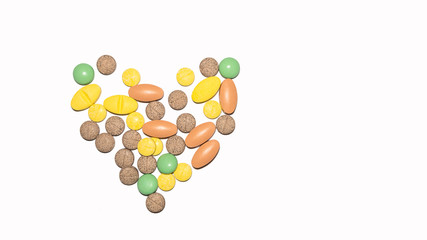  Heart-shaped multi-colored pills On a white background