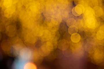 Abstract bokeh background with yellow and orange blured colors. Holiday mood and concept of...
