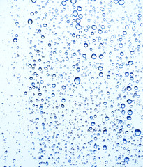 Fototapeta na wymiar Raindrops on window glass