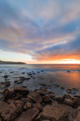 Long exposure view of Bronte Beach, Sydney with sunrise sky.
