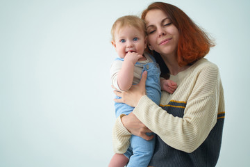 mom holds with her baby in her arms