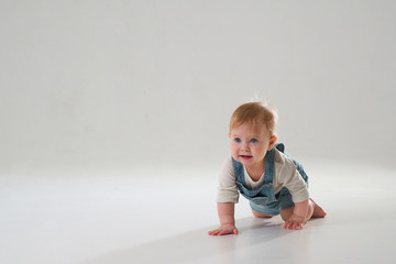 10 month old little baby learning to walk..Studio photography