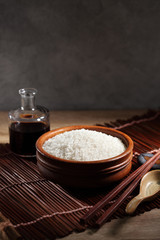 close up Japanese rice in measuring cup on table, Japanese rice in kitchen background