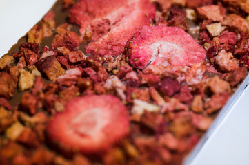 Dried strawberries on milk chocolate.
