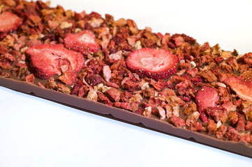 Dried strawberries on milk chocolate.