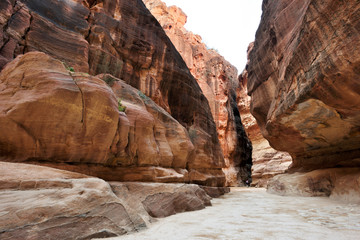 Fototapeta na wymiar Narrow passage of rocks of Petra Canyon