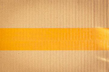 scotch tape stick wrapping on brown carton paper box package of industrial, image used for design background