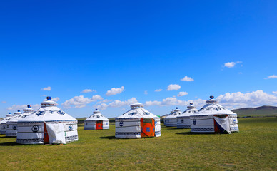 Mongolian yurt on the grassland,in the background of blue sky an