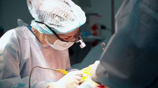 Surgical operation abdominoplasty. Close-up of the patient on the operating table, surgical removal of fat tissue from the abdomen.
