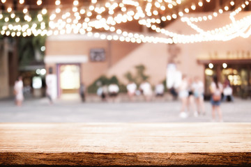 Empty wooden desk space and blurry background of restaurant vintage tone for product display montage