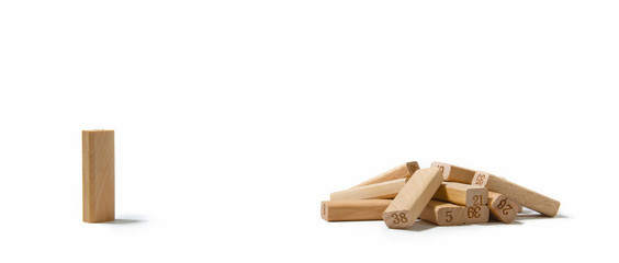Social Distancing and quarantine impact on pandemic spread of a virus in population. Concept one wooden dominoes separated from falling dominoes for containing corona virus or pandemic outbreak.