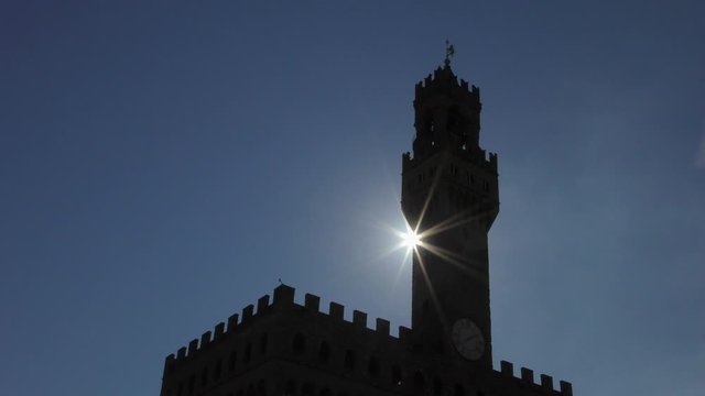 Florence, Italy. Palazzo Vecchio tower in Piazza Signoria, Italian city of Florence against the morning sun