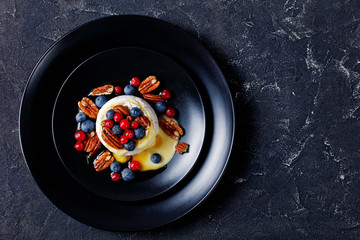 Cooked soft brie with nuts and berries, copy space