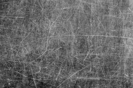 Close -up of  scratched glass surface. Black and white.