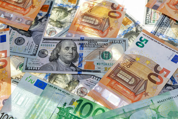 Obraz na płótnie Canvas different dollar and euro bills on a white background