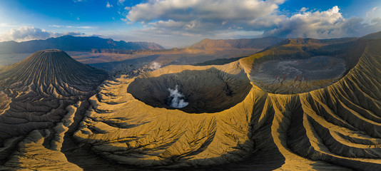 Panoramic aerial view of gas venting form an active volcano complex in late evening sunlight (Mount...